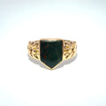Gold signet ring with bloodstone on a white background