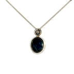18ct White Gold Oval Cabuchon Star Sapphire with Bezel Set Diamond