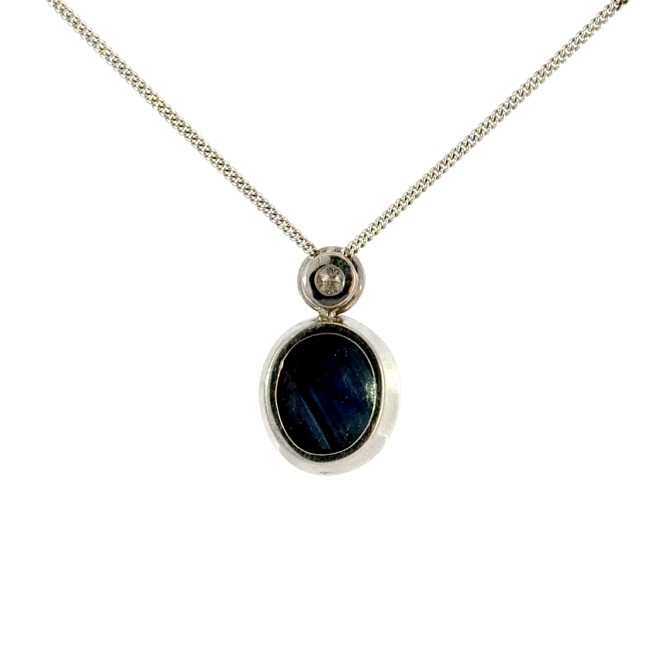 18ct White Gold Oval Cabuchon Star Sapphire with Bezel Set Diamond