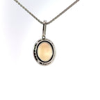 Platinum Oval Cabuchon Opal & Diamond Halo Necklace