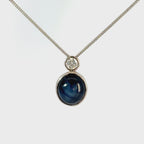 18ct White Gold Oval Cabuchon Star Sapphire with Bezel Set Diamond