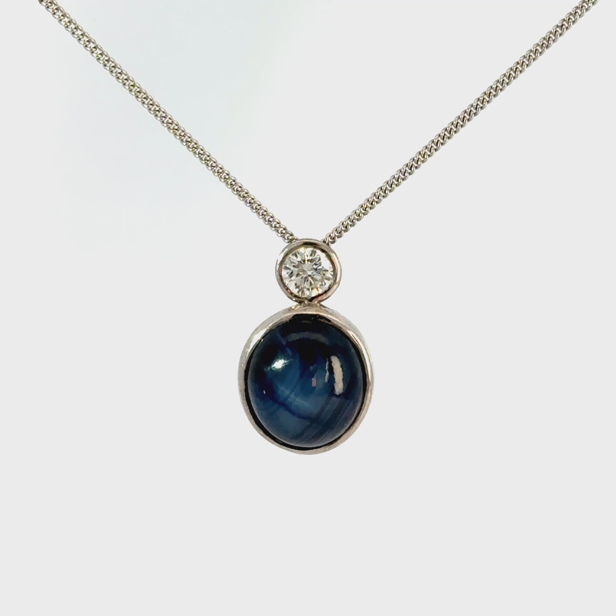 18ct White Gold Oval Cabuchon Star Sapphire with Bezel Set Diamond
